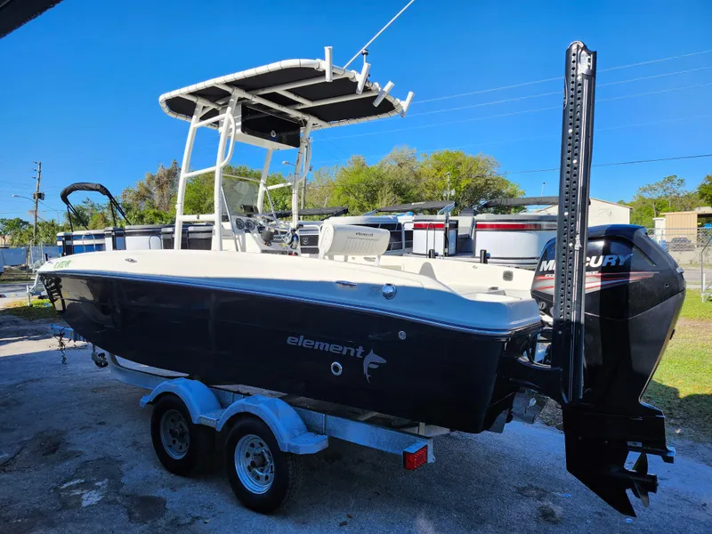 Slide: The Image of 2018 Bayliner Element F21 boat on trailer with Mercury outboard motor. - 4