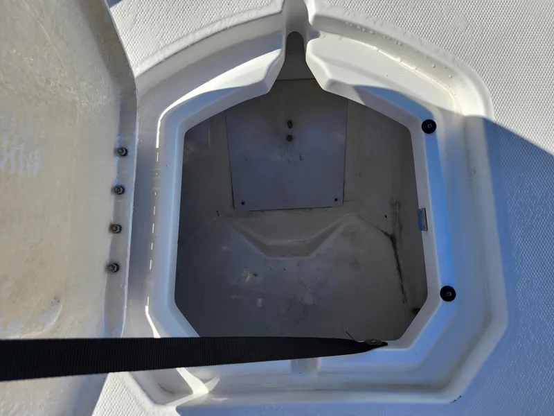 Slide: The Image of Open storage compartment on a 2018 Bayliner Element F21 boat. - 46