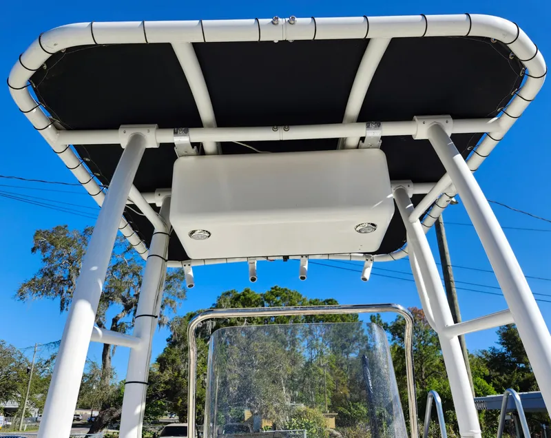 Slide: The Image of 2018 Bayliner Element F21 boat T-top with clear blue sky background. - 47