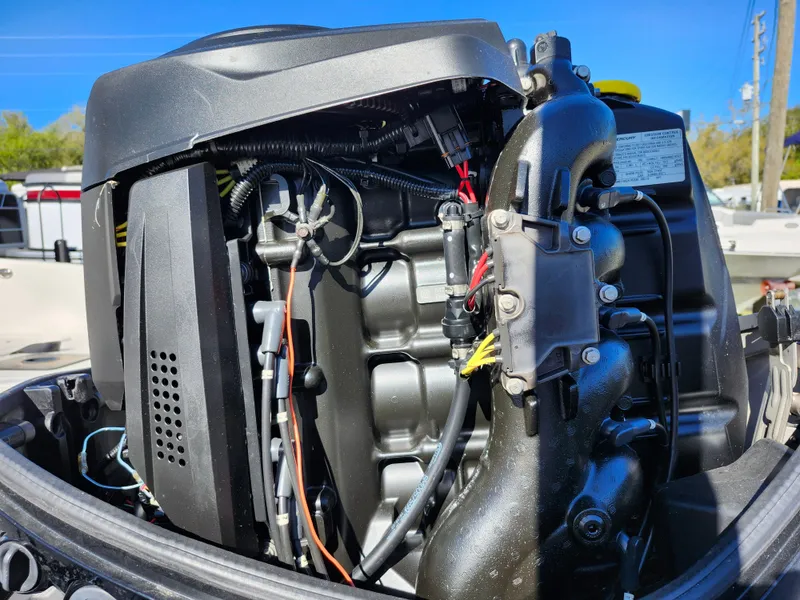 Slide: The Image of 2018 Bayliner Element F21 boat engine close-up, showcasing intricate mechanical components. - 49