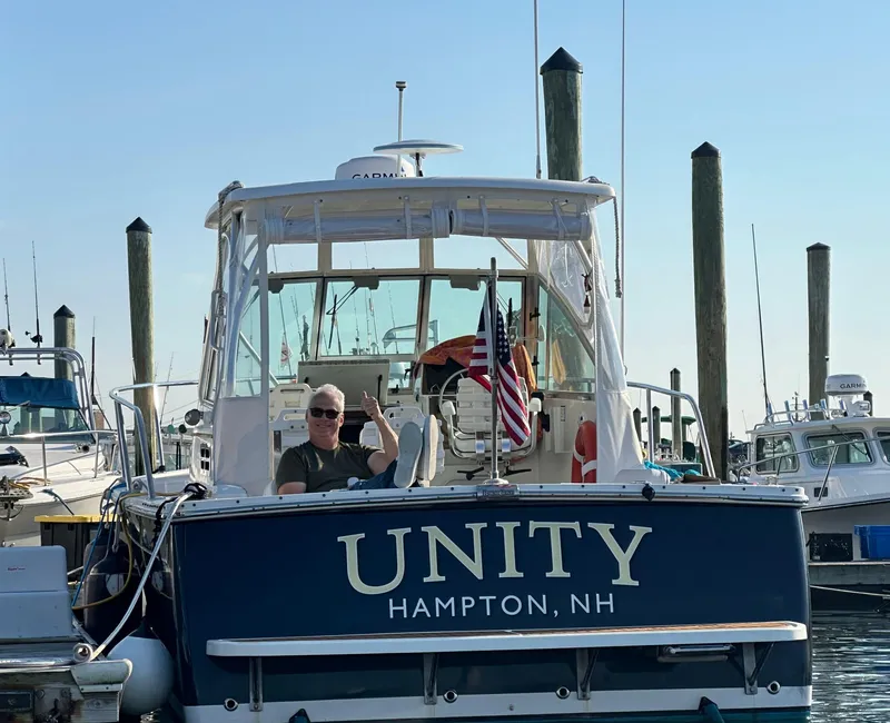Slide: The Image of 2006 Back Cove 29 boat named "Unity" docked in Hampton, NH marina. - 0