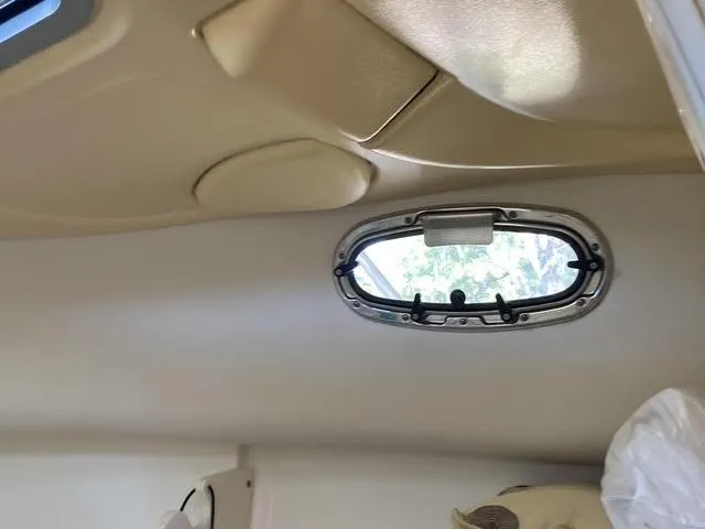 Slide: The Image of Interior cabin view of a 2008 Boston Whaler 235 Conquest boat. - 12