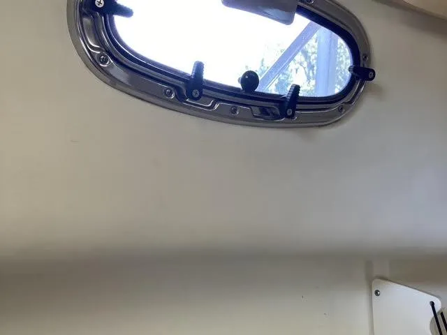 Slide: The Image of Interior view of a 2008 Boston Whaler 235 Conquest boat window. - 13