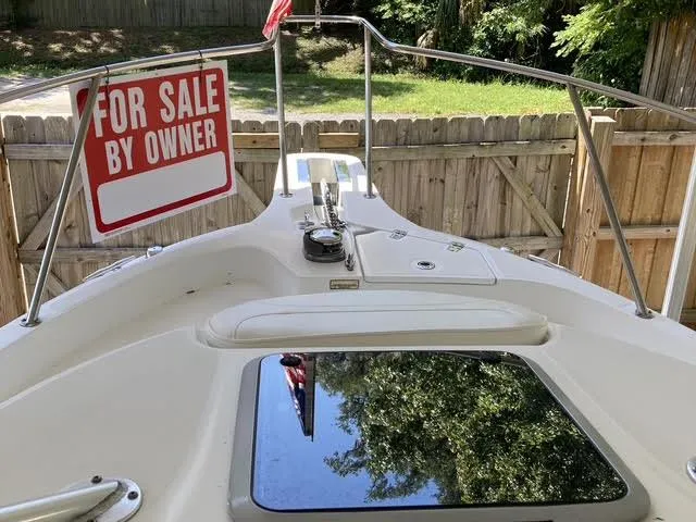 Slide: The Image of 2008 Boston Whaler 235 Conquest boat for sale by owner, docked in a yard. - 14