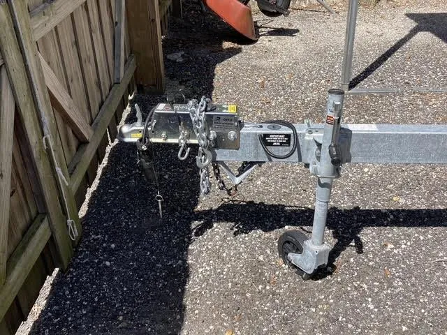 Slide: The Image of Trailer hitch for 2008 Boston Whaler 235 Conquest on gravel surface. - 22