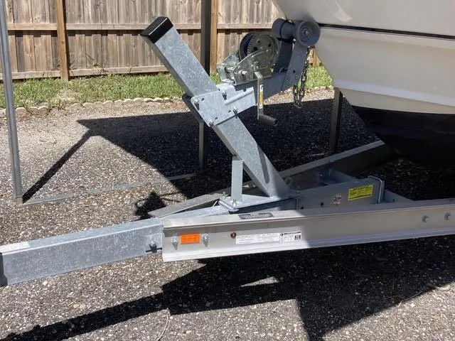 Slide: The Image of Trailer hitch of a 2008 Boston Whaler 235 Conquest boat on pavement. - 23