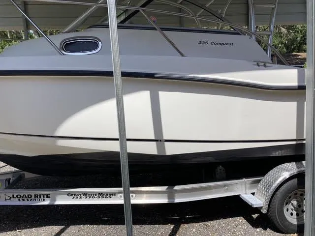 Slide: The Image of 2008 Boston Whaler 235 Conquest boat on Load Rite trailer, side view. - 26