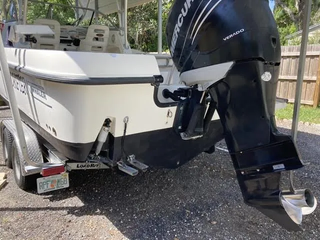 Slide: The Image of 2008 Boston Whaler 235 Conquest boat with Mercury Verado engine on trailer. - 28