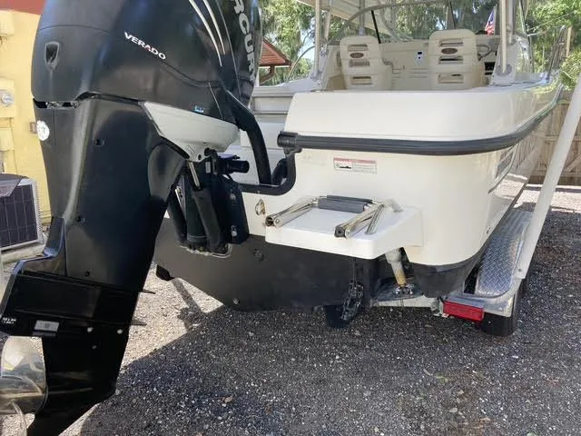 Slide: The Image of 2008 Boston Whaler 235 Conquest boat with outboard motor, rear view. - 31