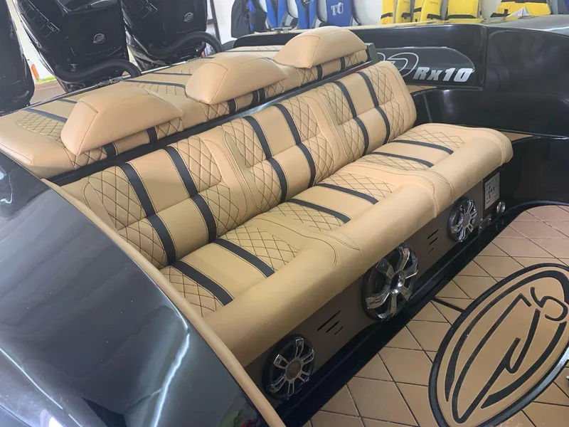 Slide: The Image of Luxurious interior of a 2018 Bernico RX10 boat with tan quilted seating. - 12