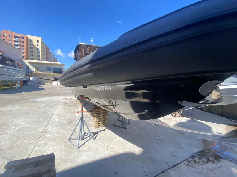 Slide: The Image of 2018 Bernico RX10 boat on stands, outdoor setting, clear blue sky. - 13
