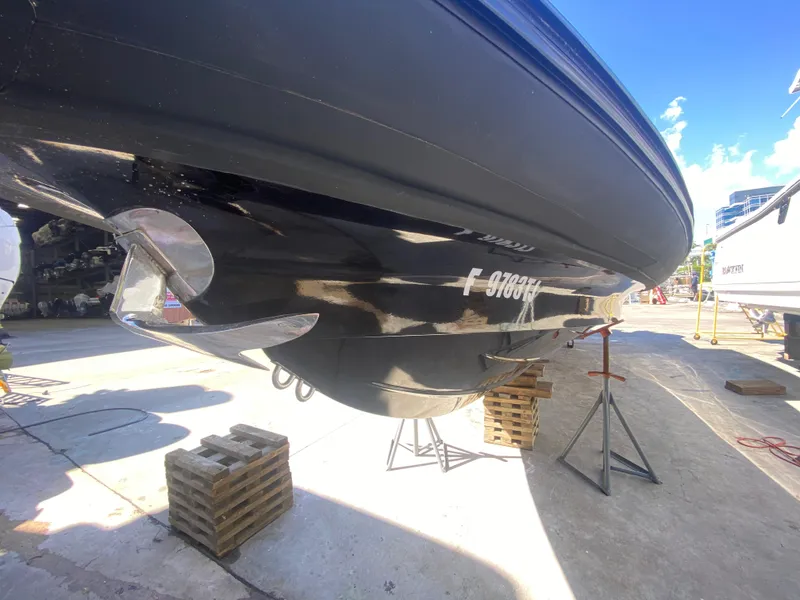 Slide: The Image of 2018 Bernico RX10 boat on dry dock, showing hull and propeller. - 14