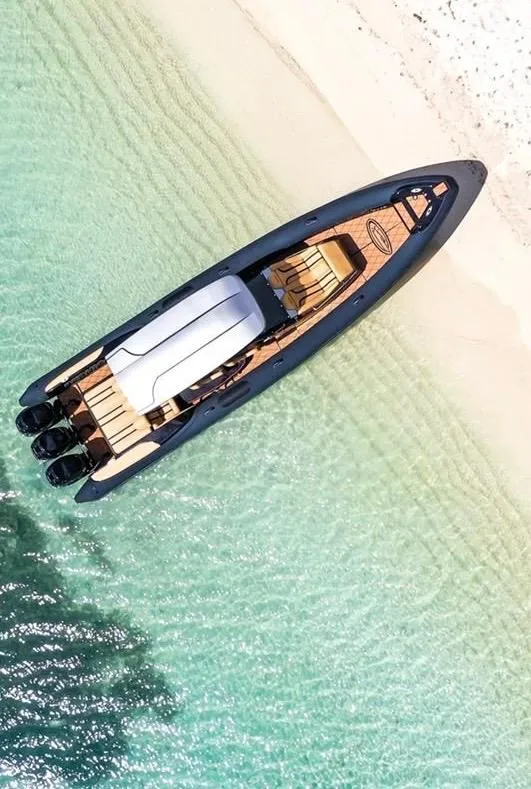 Slide: The Image of Aerial view of 2018 Bernico RX10 boat on clear turquoise water near sandy beach. - 4