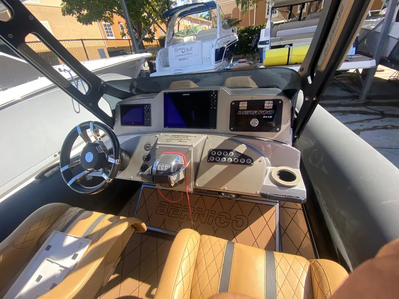 Slide: The Image of 2018 Bernico RX10 boat cockpit with modern controls and leather seating. - 9