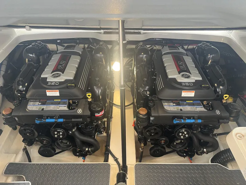 Slide: The Image of Twin engines in a 2022 Formula 330 Crossover Bowrider I/O boat. - 14