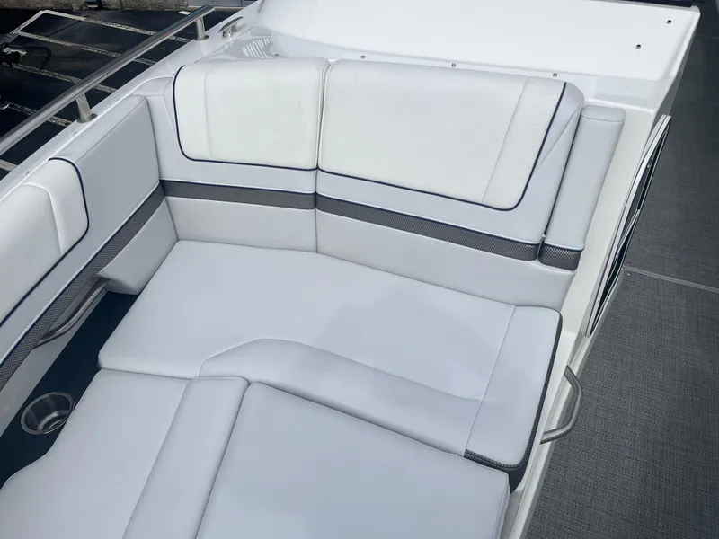Slide: The Image of 2022 Formula 330 Crossover Bowrider I/O, white cushioned seating area. - 15