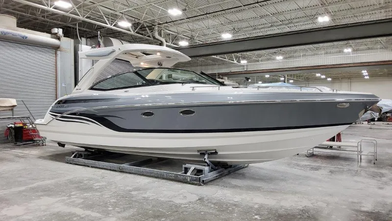 Slide: The Image of 2022 Formula 330 Crossover Bowrider I/O in a showroom, showcasing sleek design and modern features. - 19