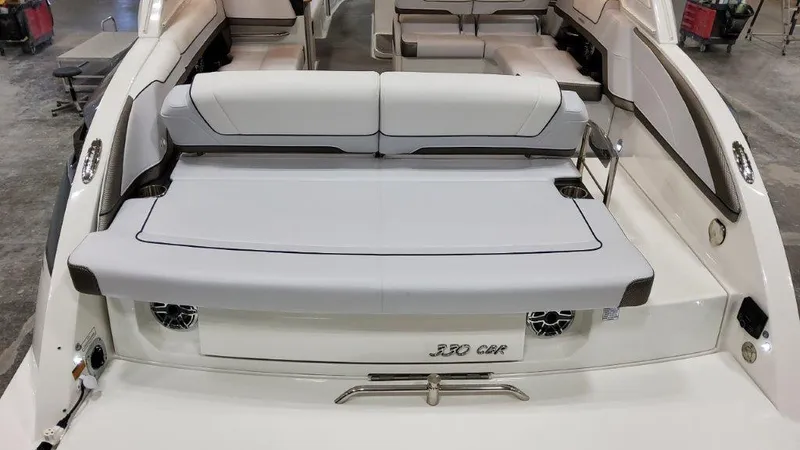 Slide: The Image of 2022 Formula 330 Crossover Bowrider I/O, rear view with seating and speakers. - 28