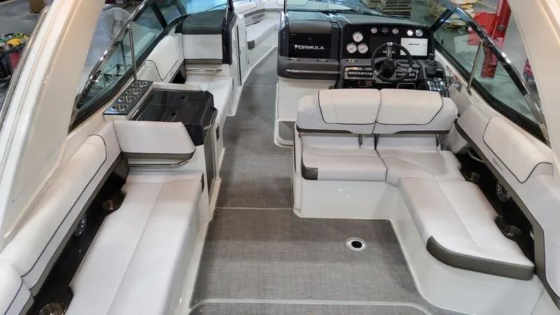 Slide: The Image of 2022 Formula 330 Crossover Bowrider I/O interior with luxurious seating and modern dashboard. - 29