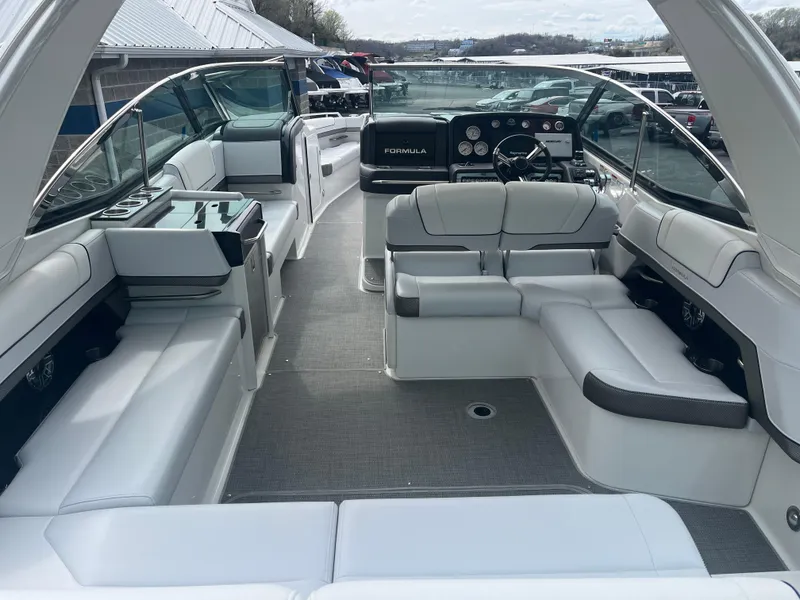 Slide: The Image of 2022 Formula 330 Crossover Bowrider I/O interior with spacious seating and modern dashboard. - 3