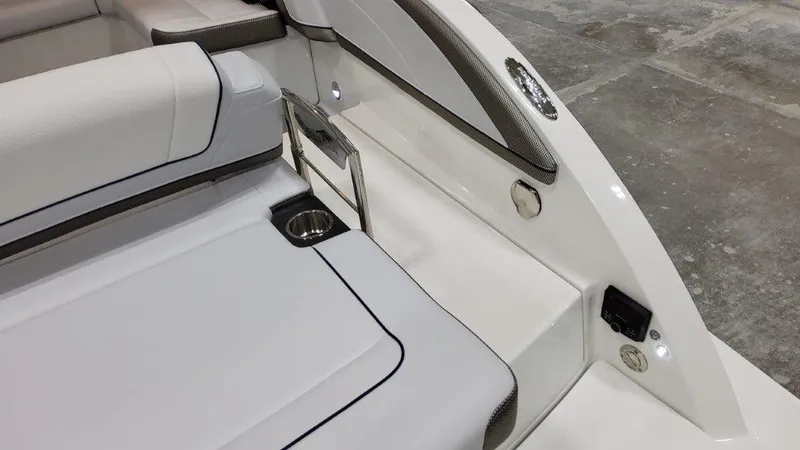 Slide: The Image of 2022 Formula 330 Crossover Bowrider I/O interior with sleek seating and cup holder. - 31