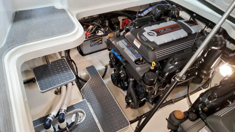 Slide: The Image of Engine compartment of 2022 Formula 330 Crossover Bowrider I/O with visible components and steps. - 33