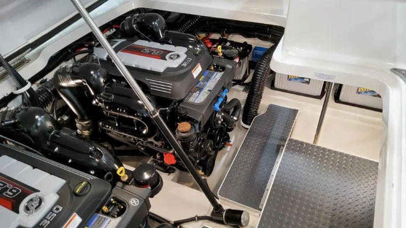 Slide: The Image of 2022 Formula 330 Crossover Bowrider I/O engine compartment with dual engines and clean layout. - 34