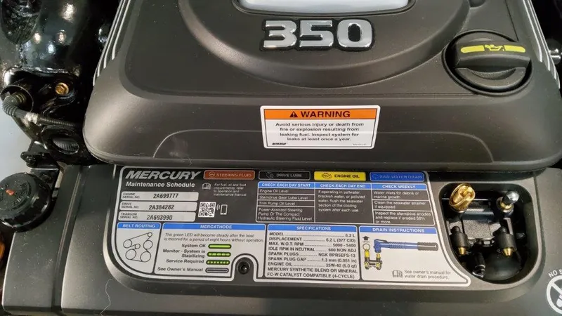 Slide: The Image of Engine cover of a 2022 Formula 330 Crossover Bowrider I/O with maintenance schedule. - 35