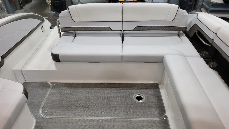 Slide: The Image of 2022 Formula 330 Crossover Bowrider I/O interior seating with gray upholstery and flooring. - 38