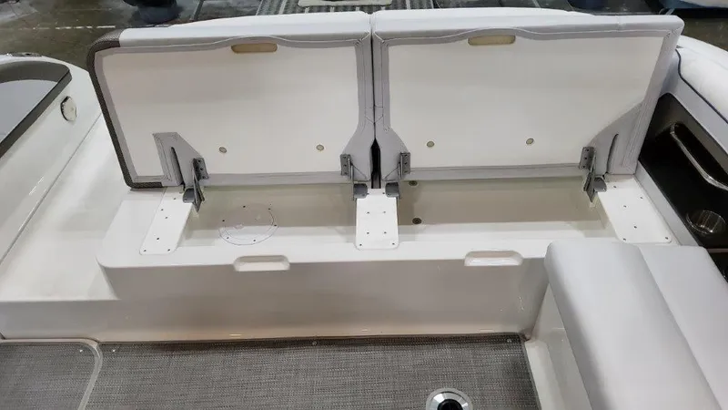 Slide: The Image of 2022 Formula 330 Crossover Bowrider I/O storage compartment with open hatches. - 39