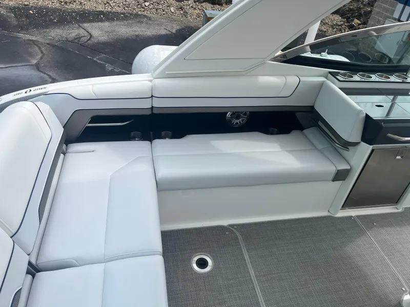 Slide: The Image of 2022 Formula 330 Crossover Bowrider I/O interior with white seating and modern design. - 4