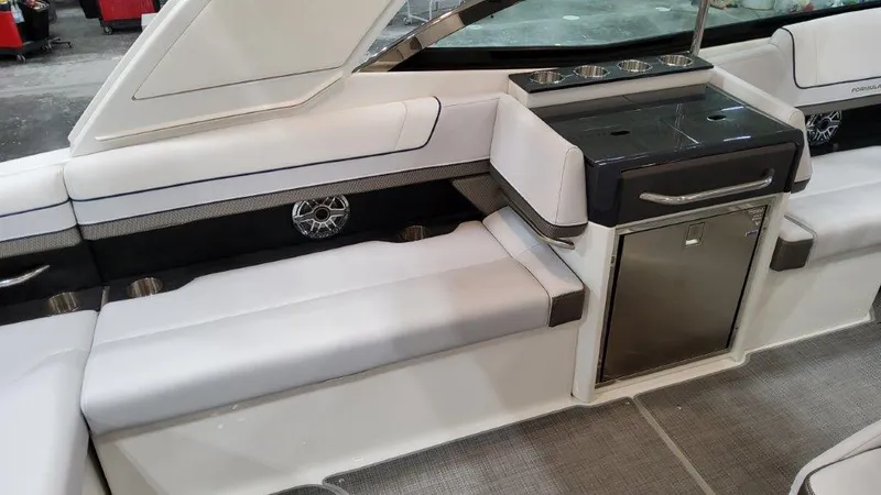 Slide: The Image of 2022 Formula 330 Crossover Bowrider I/O interior with seating and built-in storage. - 43