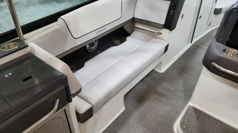 Slide: The Image of 2022 Formula 330 Crossover Bowrider I/O interior with sleek seating and modern design. - 45