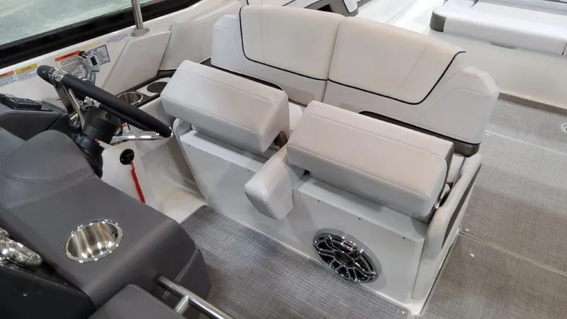 Slide: The Image of 2022 Formula 330 Crossover Bowrider I/O interior with plush seating and modern helm. - 48