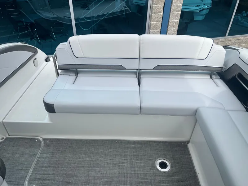 Slide: The Image of 2022 Formula 330 Crossover Bowrider I/O, featuring sleek white seating and modern design. - 5