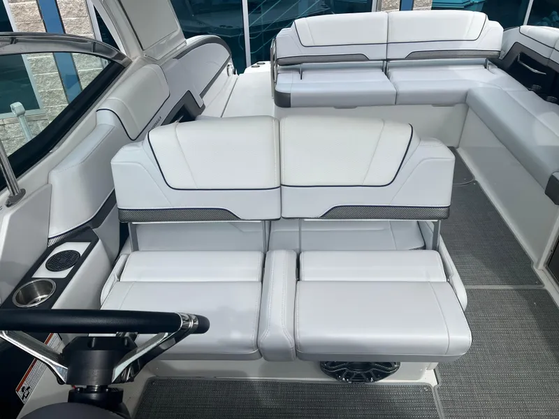 Slide: The Image of 2022 Formula 330 Crossover Bowrider I/O interior with white seating and modern design. - 9