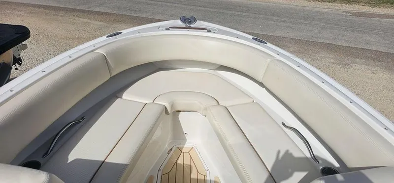 Slide: The Image of 2007 Chris-Craft Launch 22 boat interior with white cushioned seating. - 10