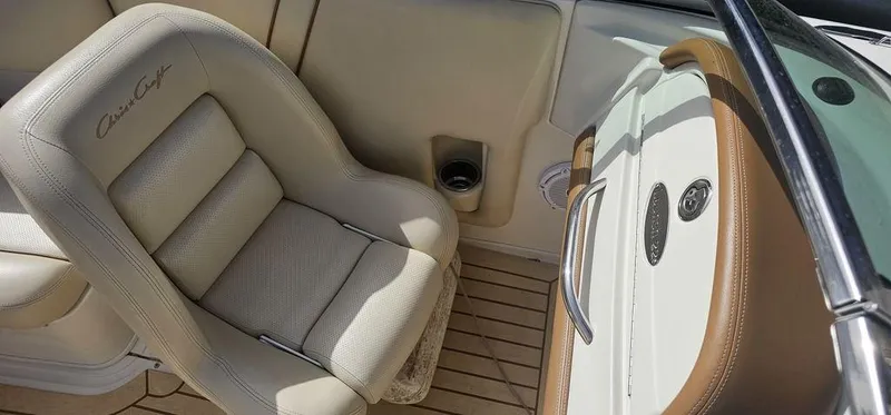 Slide: The Image of 2007 Chris-Craft Launch 22 interior with beige leather seat and wooden flooring. - 15