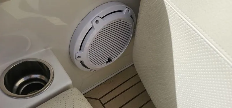 Slide: The Image of 2007 Chris-Craft Launch 22 interior with speaker and cup holder on wooden deck. - 17