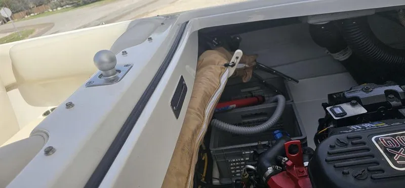 Slide: The Image of 2007 Chris-Craft Launch 22 engine compartment with visible components and wiring. - 18