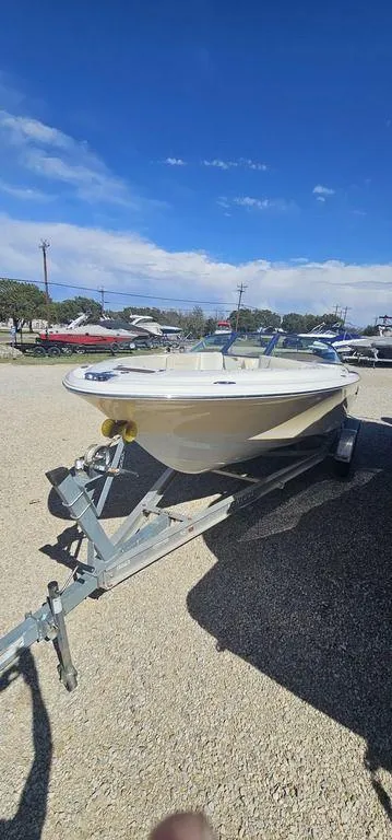 Slide: The Image of 2007 Chris-Craft Launch 22 boat on trailer under clear blue sky. - 6