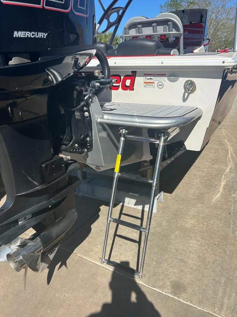 Slide: The Image of Boat with Mercury engine, Concept 30 SD model, featuring a swim platform and ladder, 2009. - 17