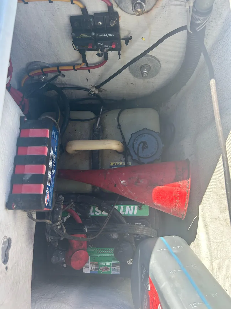 Slide: The Image of Engine compartment of a 2009 Concept 30 SD boat with various components visible. - 23