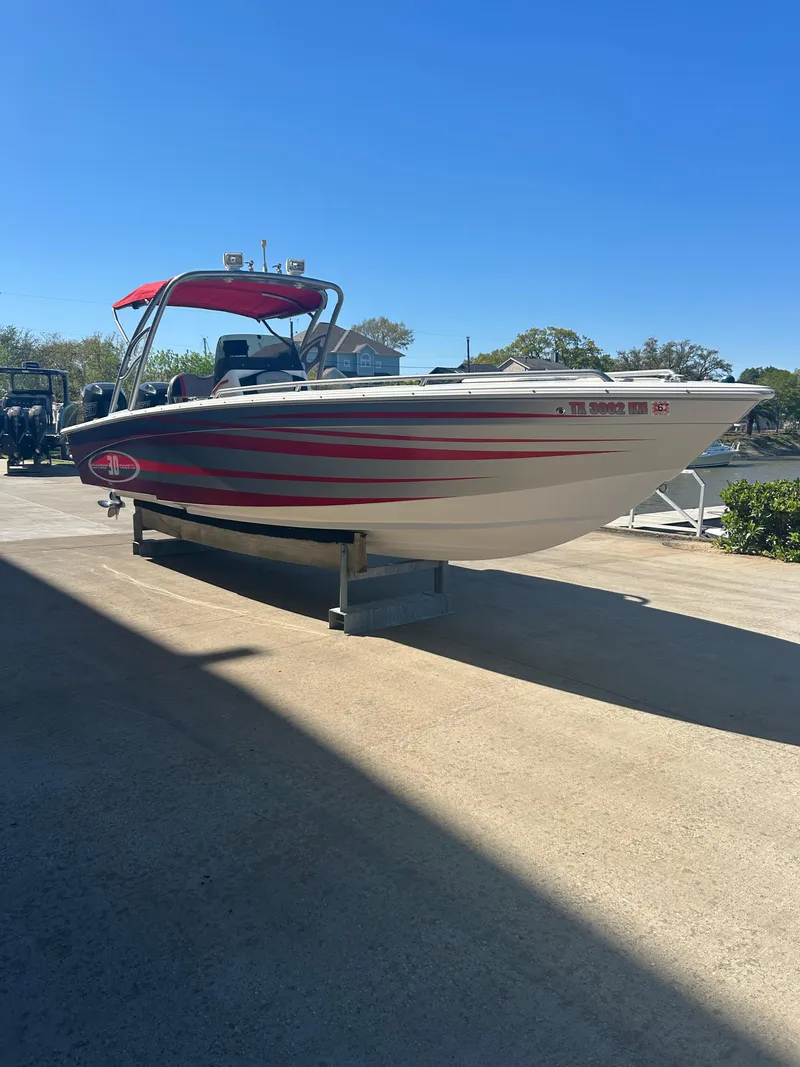 Slide: The Image of 2009 Concept 30 SD boat with red accents on a sunny day. - 3