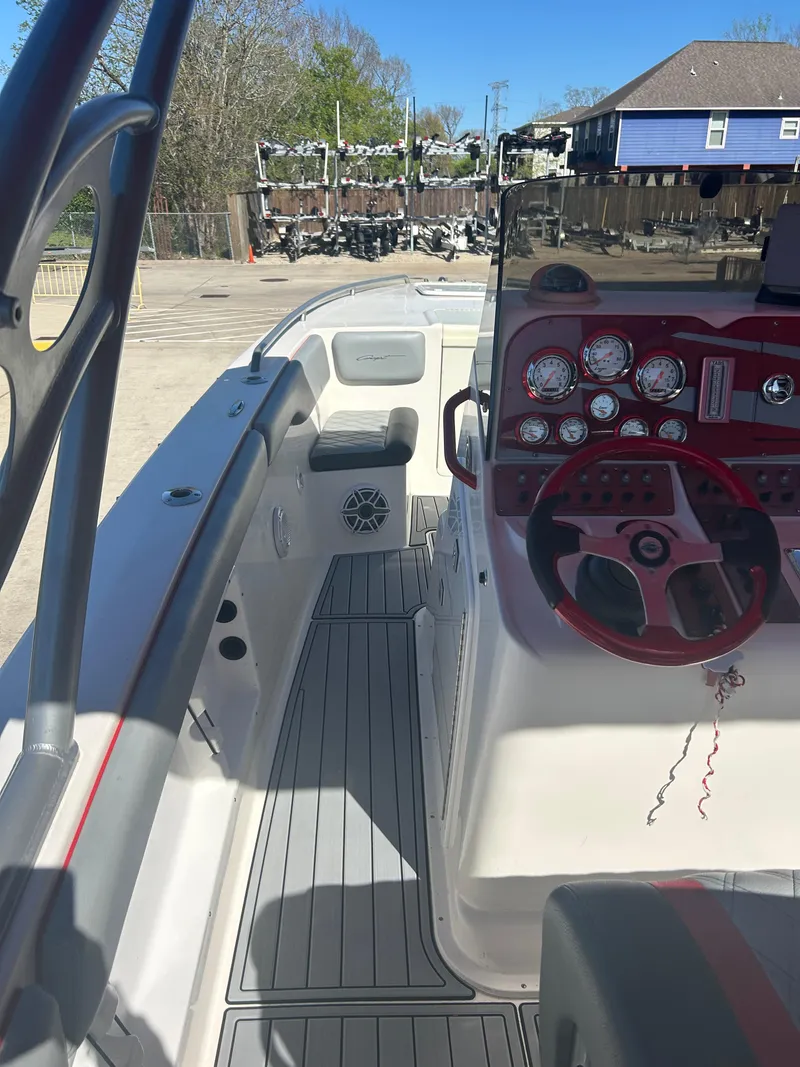 Slide: The Image of 2009 Concept 30 SD boat interior with red steering wheel and control panel. - 31