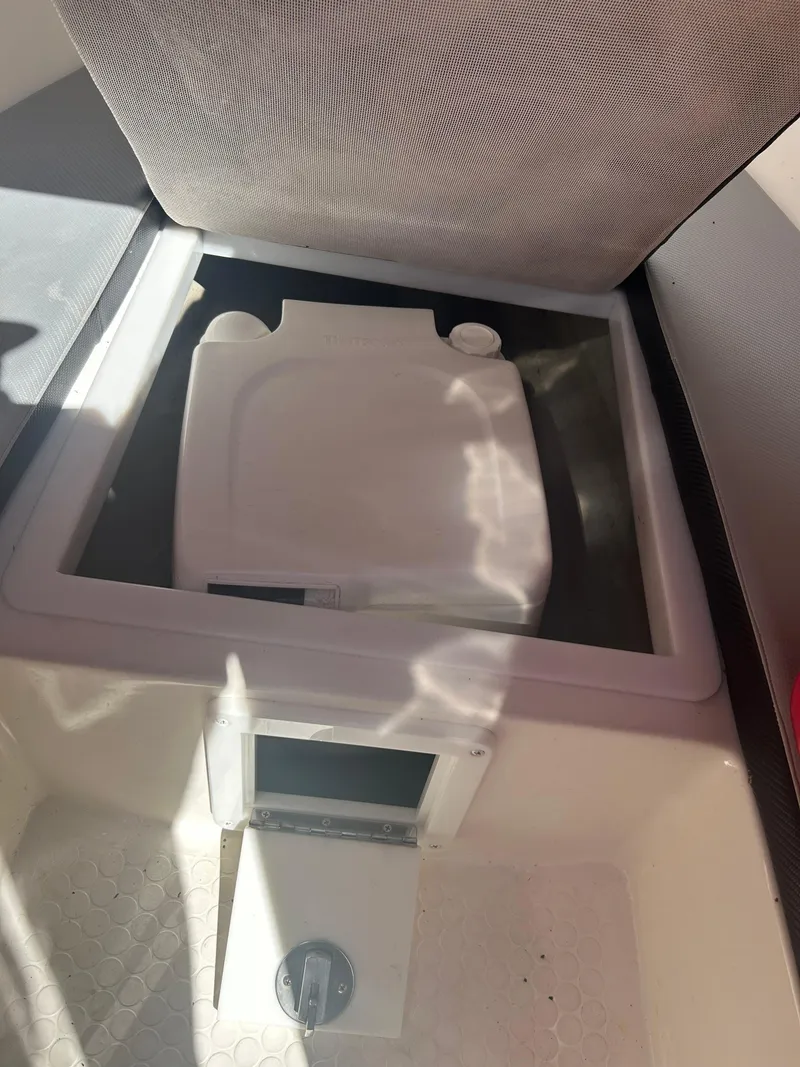 Slide: The Image of 2009 Concept 30 SD boat storage compartment with open lid. - 37