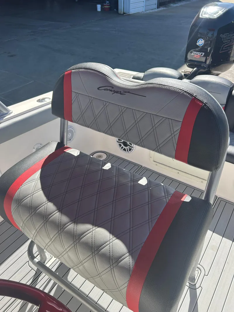 Slide: The Image of Luxury boat seat with red accents, Concept 30 SD 2009 model, in a sunlit marine setting. - 43