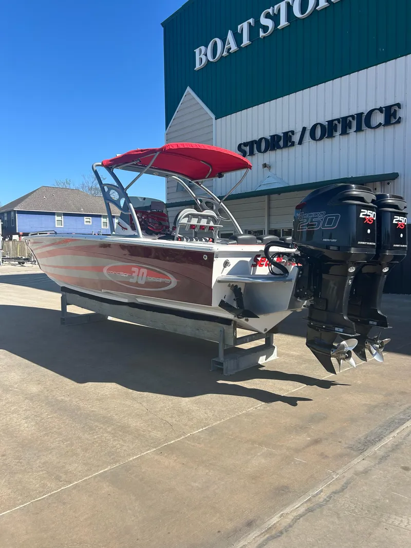 Slide: The Image of 2009 Concept 30 SD boat with twin engines at a boat store. - 7
