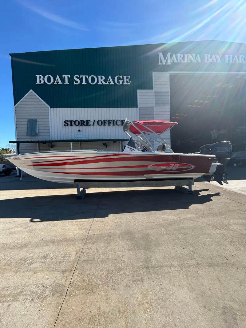 Slide: The Image of 2009 Concept 30 SD boat with red accents at Marina Bay Harbor storage. - 8
