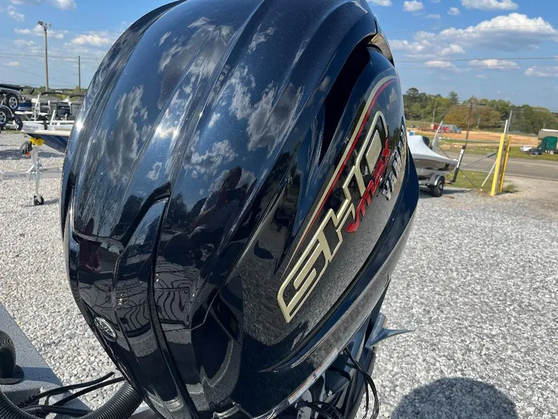 Slide: The Image of 2022 Xpress X19 Pro outboard motor with SHO VMAX branding, reflecting blue sky and clouds. - 11